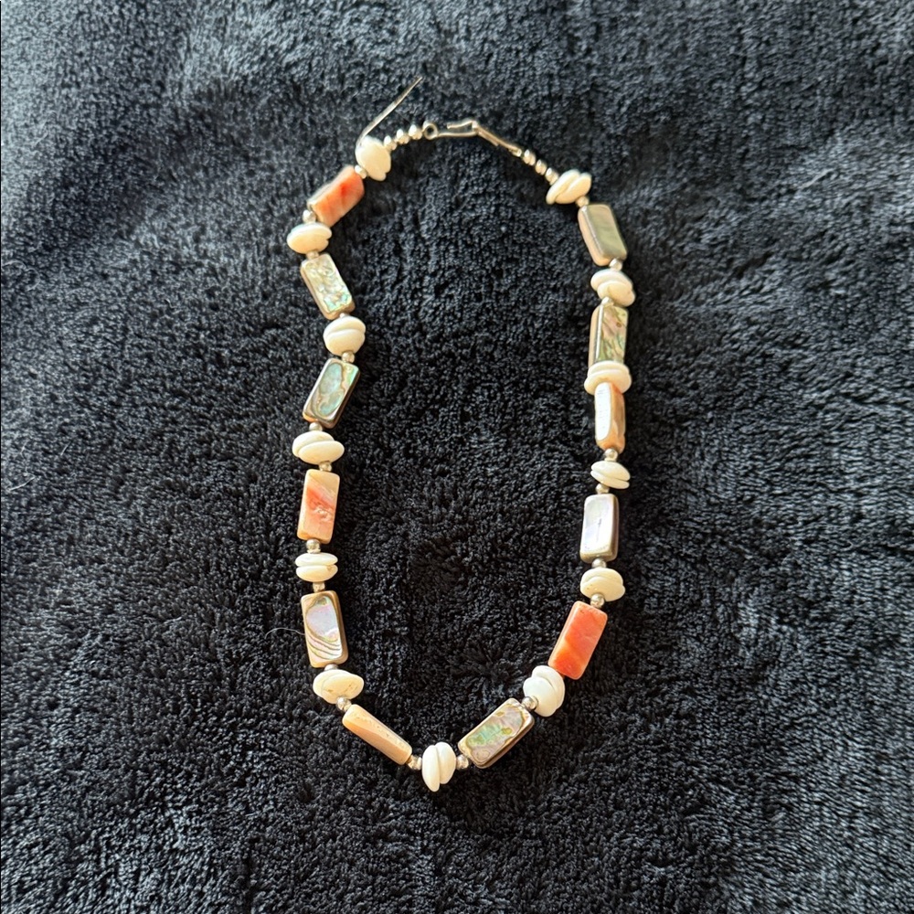 Elegant Beaded Necklace with Orange and Cream Accents